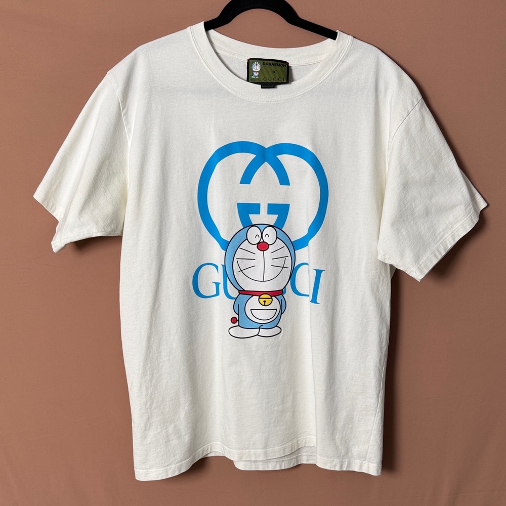Gucci X Doraemon Men’s Cream Tee with Blue Cartoon Design